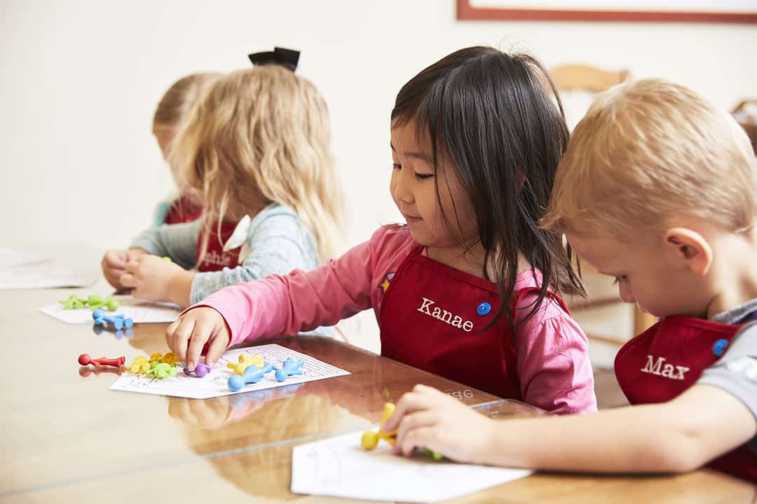 Mentally strong child using manipulative during math class