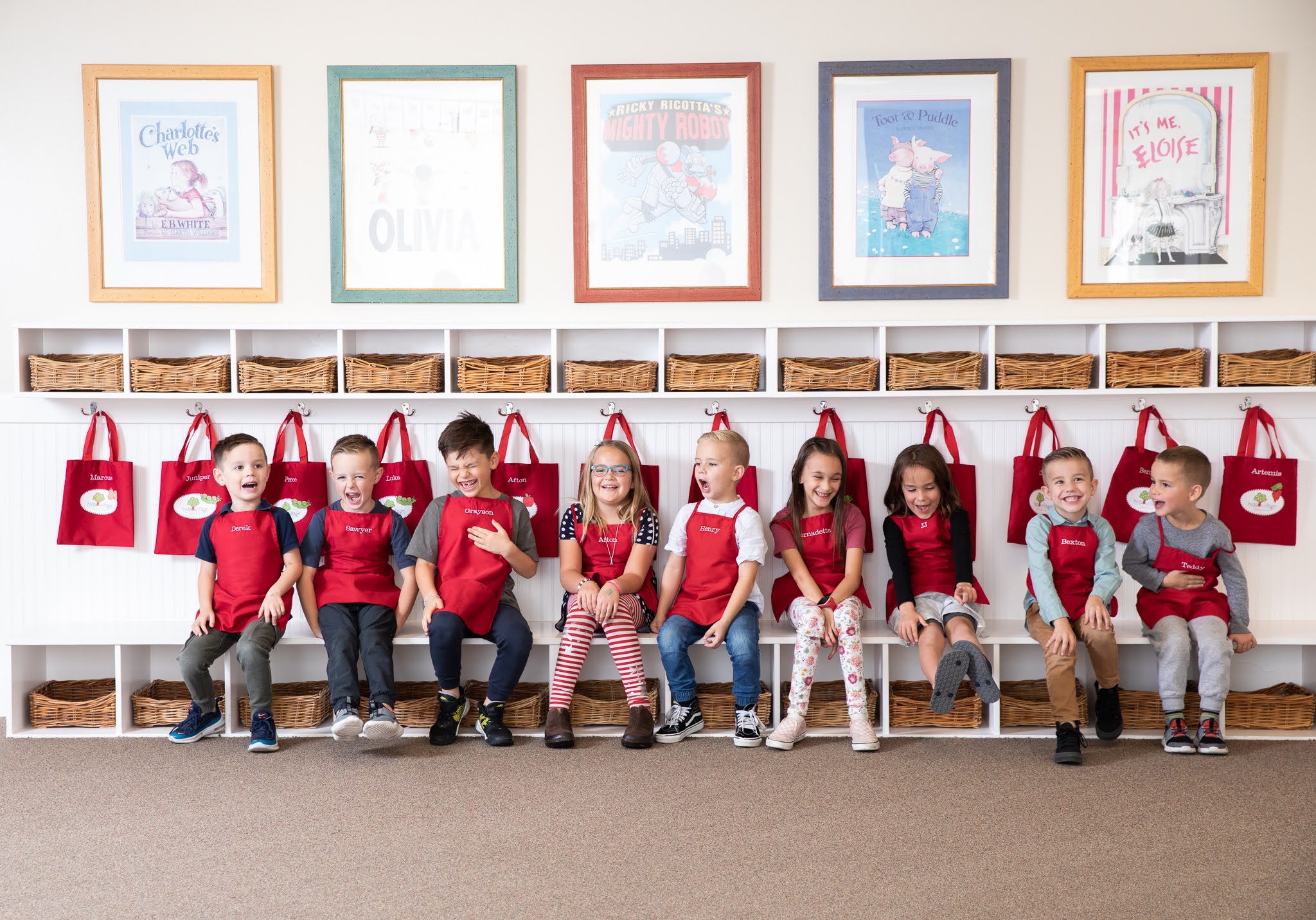 Kids sitting on a bench at school