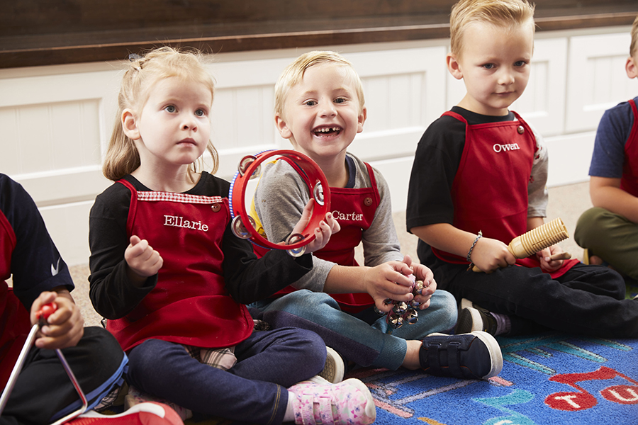 Kids Village Private Preschool Students at Kids Village Private Preschool playing music during music workshop