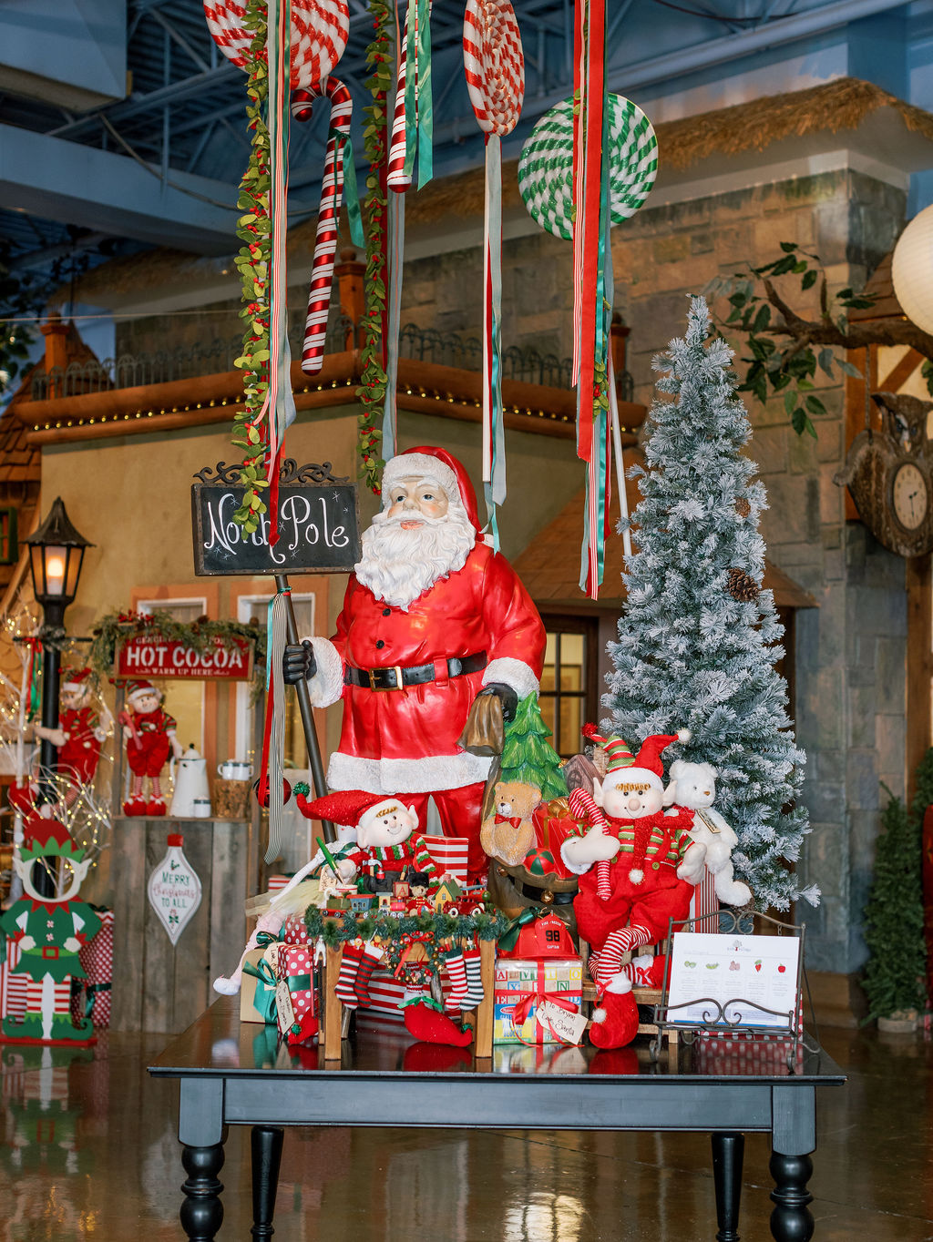 Christmas decorations on a table in front of beautifully decorated kids village private school (preschool and kindergarten) entry foyer